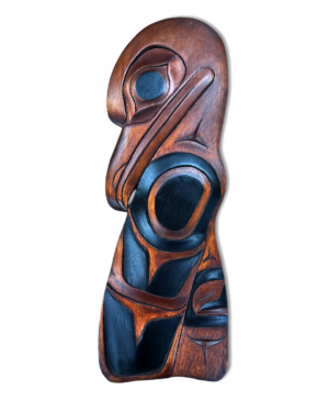 Raven carved plaque with black paint and warm stained wood grain
